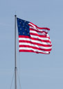 The flag that flies over Fort McHenry by day. The same flag design that flew over the fort in the war of 1812. Note the 15 start and also the 15 stripes.