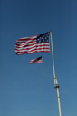 In the afternoon the Fort McHenry flag is switched out with the current flag. This is just before the switch and the current flag goes up.