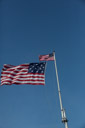 And ther the star spangled banner comes down. For a moment both flags are inplace.
