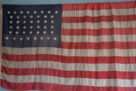 Note that the flag has 44 stars which represented the number of states at the time South Pass City was founded