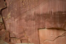 Here we have very elaborate big horns. Note the hoves are cloven on both and ears are indicated on both. Both are in toto petroglyphs and based on repatination they are probably older than the 'Fremont' sequence in the main panel. Note the sheep damaged by spalling on the right.  Could this be a basis of dating???