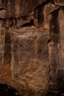 Chalking on this glyph really makes it hard to evaluate. You see the chalking is not exactly on the glyph and is on only a portion of the glyph.  There is actually a faint head indicated on the figure. Arms may be indicated and also stubby legs. The top portion of the torso is decorated with chevrons, the top couple further divided by vertical lines. There are also some horizontal lines across the bottom of the figure and what maay have been part of another figure.