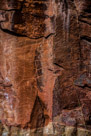 This is one of the grid like figures that occur with this rock art style.  There is some spalling that has damaged the center of the figure. But it appears to be a roughly four row by three column  grid on blank spaces with some additional lines going off from the lower left corner. The grid spaces are not regular, the third column being much wider. There appears to be an additional square at the lower right.